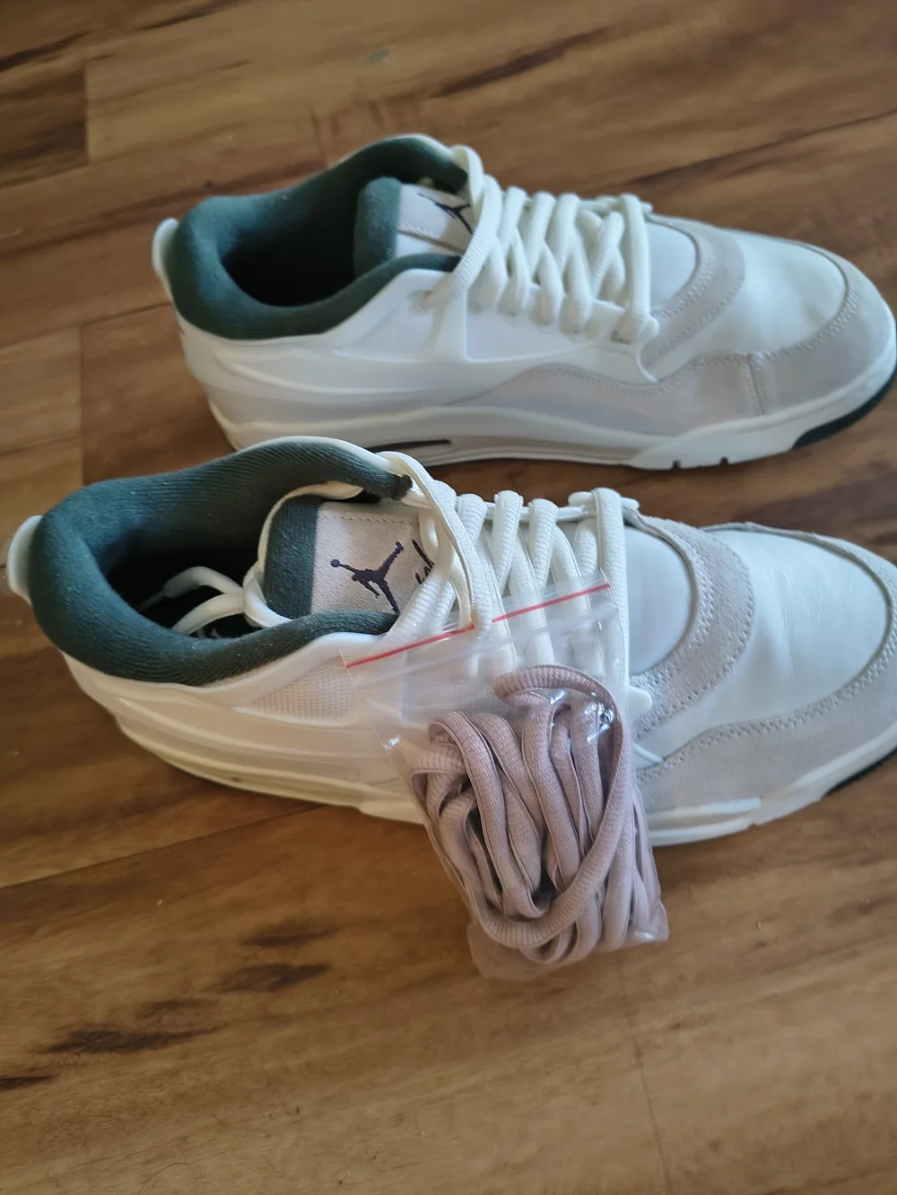 Air Jordan 4 RM White & Teal Mid Sneakers